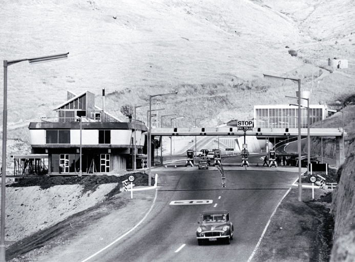 Administration building and portal on the Heathcote side of the Christchurch-Lyttelton Road Tunnel. Note toll booths. Administration building and portal on the Heathcote side of the Christchurch-Lyttelton Road Tunnel. Note toll booths.