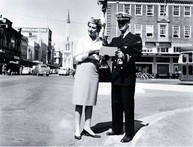 Male and female cabin crew of TEAL standing at the corner of Colombo and Armagh Streets Male and female cabin crew of TEAL standing at the corner of Colombo and Armagh Streets