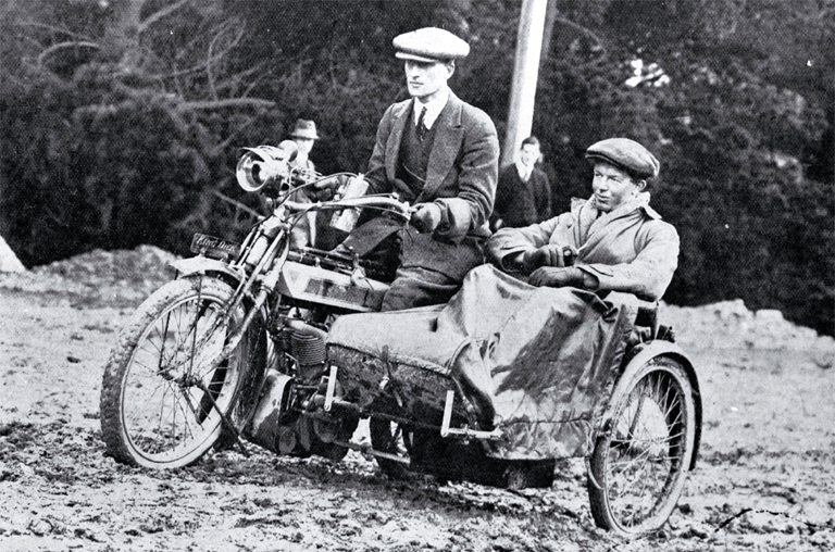 H S Jones and companion on his " King Dick", winner of the severe reliability and petrol consumption test H S Jones and companion on his " King Dick", winner of the severe reliability and petrol consumption test