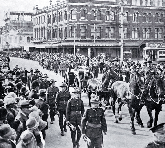 The gun carriage and firing party follow the wreath bearers, Christchurch The gun carriage and firing party follow the wreath bearers, Christchurch