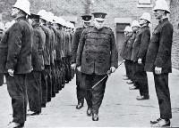 Superintendent W H Mackinnon makes his last inspection of his men, as the Christchurch police force bid him farewell
