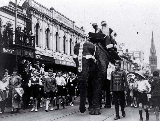 A Christmas parade passes along Colombo Street, Christchurch A Christmas parade passes along Colombo Street, Christchurch