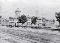 Delivery carts in Cathedral Square between the Godley statue & the Post Office, originally the Government Buildings, Christchurch. 