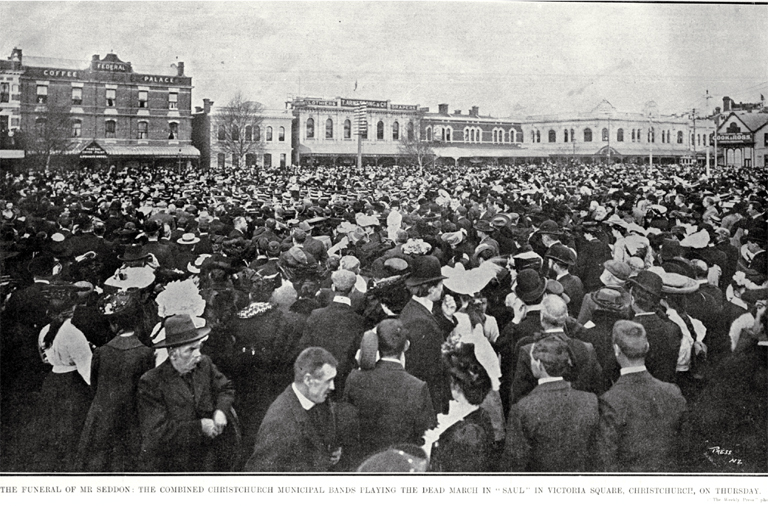 A crowd of mourners listen to the combined Christchurch municipal bands play the Dead march at Hon R J Seddon's memorial service, Victoria Square A crowd of mourners listen to the combined Christchurch municipal bands play the Dead march at Hon R J Seddon's memorial service, Victoria Square