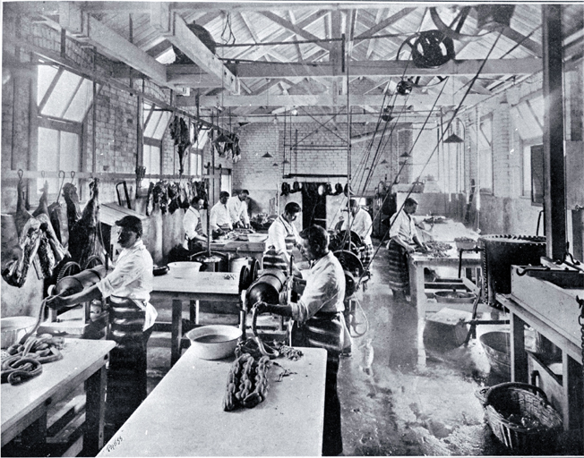 A small goods factory in Cashel Street, Christchurch : employees of the Christchurch Meat Co. Ltd. dicing meat and making sausages. A small goods factory in Cashel Street, Christchurch : employees of the Christchurch Meat Co. Ltd. dicing meat and making sausages.