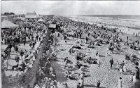 A crowded New Brighton beach, New Zealand, on gala day
